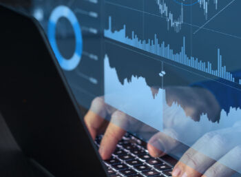 Trading on stock exchange market and investment strategy for financial assets with person using online software to analyze price statistics and trade from home at night to make profit